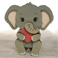 Gray wooden baby elephant shelf sitter holding a red heart